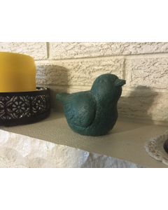 This Item is A Decorative  Green Bird .  It Weighs 1 Pound 12 Ounces and is 4"h  x 5.5"L X 3.5" D There are a few flakes of paint off of it.
