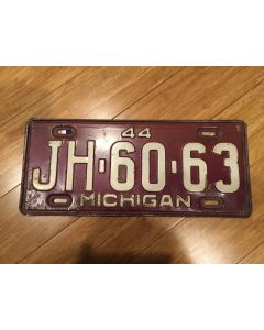 Antique Michigan License Plate 1944 JH-60-63. White on maroon, "44" on top—"MICHIGAN" on bottom