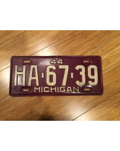 Antique Michigan License Plate 1944 HA-67-39. White on maroon, "44" on top—"MICHIGAN" on bottom  Single Plate Issued.   Condition as Pictured.  
