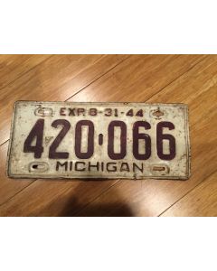Unique Antique Michigan License Plate 1944 420-066. Maroon on White , "Exp. 8-31-44" on top—"MICHIGAN" on bottom  Single Plate Issued.   Condition as Pictured.  