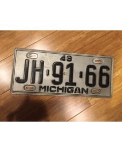 Antique Michigan License Plate 1948.  Black on Silver.  "48" On Top.  "Michigan" on Bottom.  Single plate issued. Condition as Pictured.  JH-91-86as Pictured.  PJ-42-68